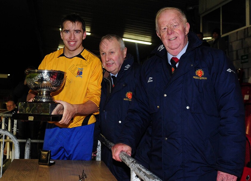 1575983 
 College Corinthians captain Ricky O'Sullivan with MSL's Pat Lyons and Tony Murphy after defeating Midleton in the Keane cup final against Midleton FC at Turners Cross
Picture: Eddie O'Hare