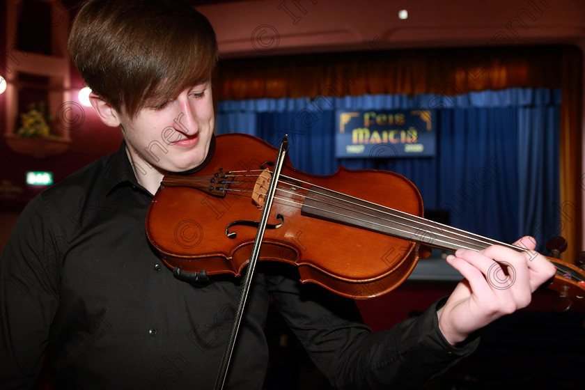 Feis06022020Thurs18 
 18
Performer Fionn Long from Turners Cross tuning before his performance.

Class: 256: “The Moloney Perpetual Cup” Viola Concerto

Feis20: Feis Maitiú festival held in Father Mathew Hall: EEjob: 06/02/2020: Picture: Ger Bonus. 9:30am