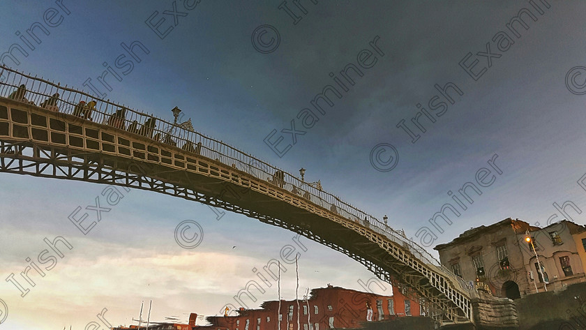 James Grandfield 
 Taken on a cold December afternoon, with crystal clear Liffey waters giving back a lovely reflection of the Ha'Penny Bridge, Dublin City. Picture: James Grandfield