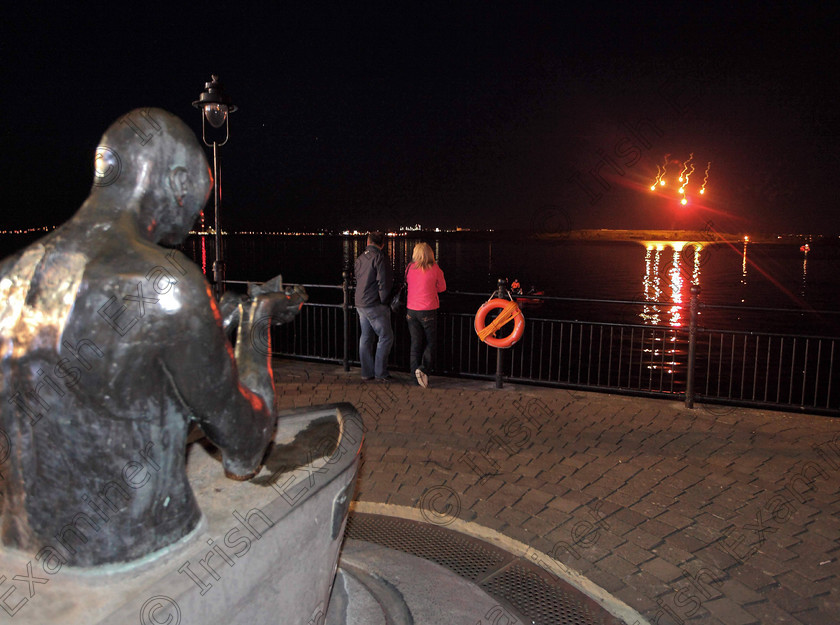 JH Titanic 100 Finale 02 
 ECHO NEWS: 12/04/2012; The Finale of "An Irish Connection" concert in Cobh sees a total of one hundred flares being set off from Spike Island in front of the sculpture, 'The Navigator', on the waterfront in memory of the lives lost on board the Titanic during the Titanic 100 commemoration events. Picture: John Hennessy