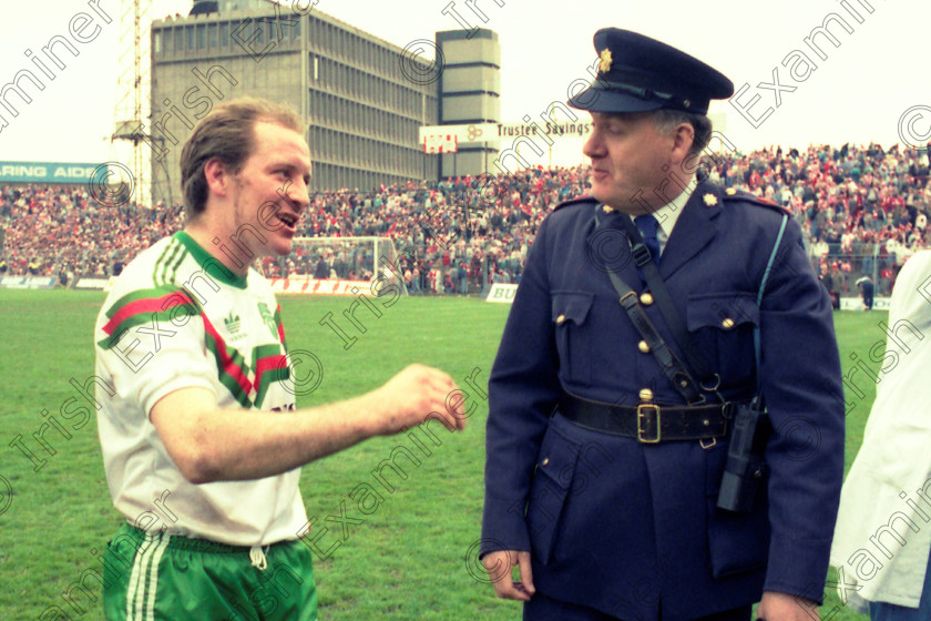 1279281 
 Soccer FAI Cup Final at Dalymount Park Dublin , Cork City v Derry City . Dave Barry chats to a member of the Garda Siochana . ref no 405/112 30/4/89 1989