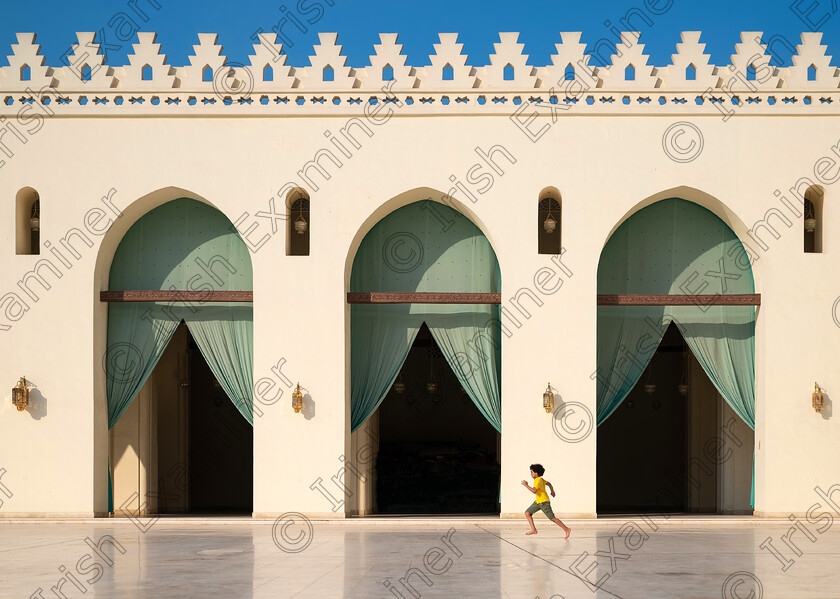 Yellow 
 Young boy running inside the courtyard of Al-Hakim Mosque in Cairo, Egypt. Al-Hakim Mosque is the fourth oldest mosque in Egypt.