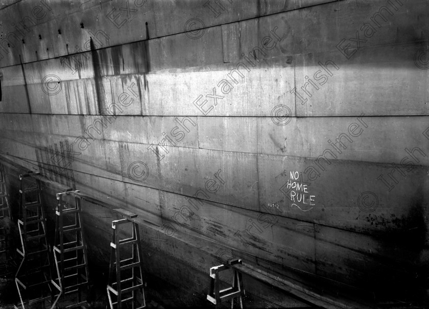 432449 
 Please archive -
Loyalist political slogans painted along the side of the the liner RMS Titanic while it was under construction at Harland and Wolf shipyards in Belfast. The keel was laid on 31/03/1909 and the ship was completed on 2/04/1912. Ten days later, on its maiden voyage, the liner struck an iceberg. Of the 2228 passangers and crew aboard only 705 survived. 
Ref.114/115 
Old black and white ships liners disasters