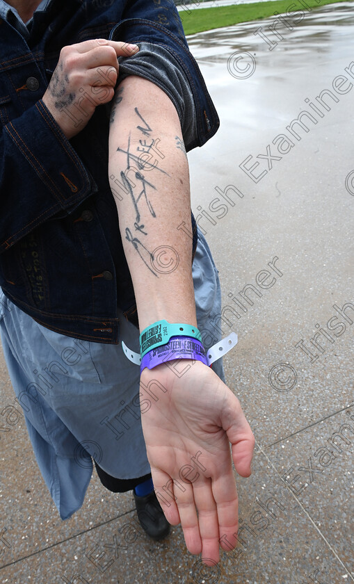 LC-bruce-fans-08 
 FEATURES IRISH EXAMINER - Showing her tattoo is Heidi Cron from New York who has purchased tickets for shows in Cardiff, Belfast, Kilkenny, Cork, Dublin, Sunderalnd, Milan and London. Fans gathered for 10am roll call on Wednesday morning. They are queuing for priority admission to the Bruce Springsteen and the E Street Band stadium concert at Supervalu Pairc Ui Chaoimh, Cork on Thursday. ,'Roll-Call' is at the 5 Points Coffee Kiosk at Marina Park, for fans who want to secure front of stage access in the pit. Fans have to attend three roll-calls per day to maintain their position in the queue and will be escorted into the stadium venue ahead of the public gate opening, ensuring they have best positions at the barrier at the front of the stage. Some fans attending the roll call had travelled from New York, South Africa, Sweden, The Netherlands, Japan, Italy, Barcelona, and the UK as well as dedicated Irish fans. Pic Larry Cummins