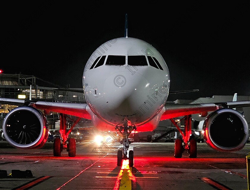 James Grandfield arriving aircraft 
 An aircraft arriving on to stand at Dublin Airport a few nights ago. Just got the lower beacon lighting up.