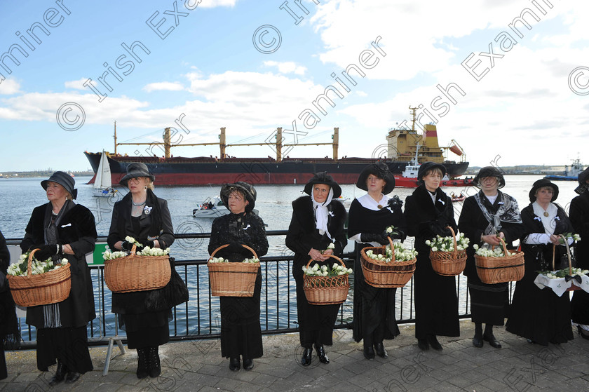 Ex dan periosd 1 
 Irish Examiner Picture 15-04-2012
A Cargo ship heading out of the harbour as ladies dressed in period costume take part in the closing cermony of the R.M.S. Titanic Centenary Commemoration in the town park, Cobh, Co Cork. Picture Dan Linehan