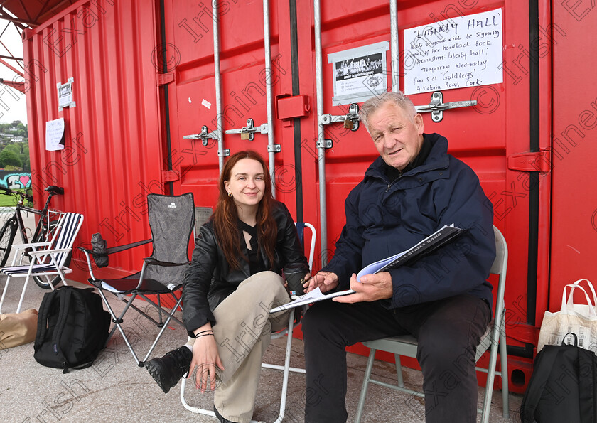 LC-bruce-fans-11 
 FEATURES IRISH EXAMINER - Irish fans Alice Coppen, from Wexford and Jim Conway from Limerick look over a book of photos of 'The Boss' while attending the roll-call. Fans gathered for 10am roll call on Wednesday morning. They are queuing for priority admission to the Bruce Springsteen and the E Street Band stadium concert at Supervalu Pairc Ui Chaoimh, Cork on Thursday. ,'Roll-Call' is at the 5 Points Coffee Kiosk at Marina Park, for fans who want to secure front of stage access in the pit. Fans have to attend three roll-calls per day to maintain their position in the queue and will be escorted into the stadium venue ahead of the public gate opening, ensuring they have best positions at the barrier at the front of the stage. Some fans attending the roll call had travelled from New York, South Africa, Sweden, The Netherlands, Japan, Italy, Barcelona, and the UK as well as dedicated Irish fans. Pic Larry Cummins