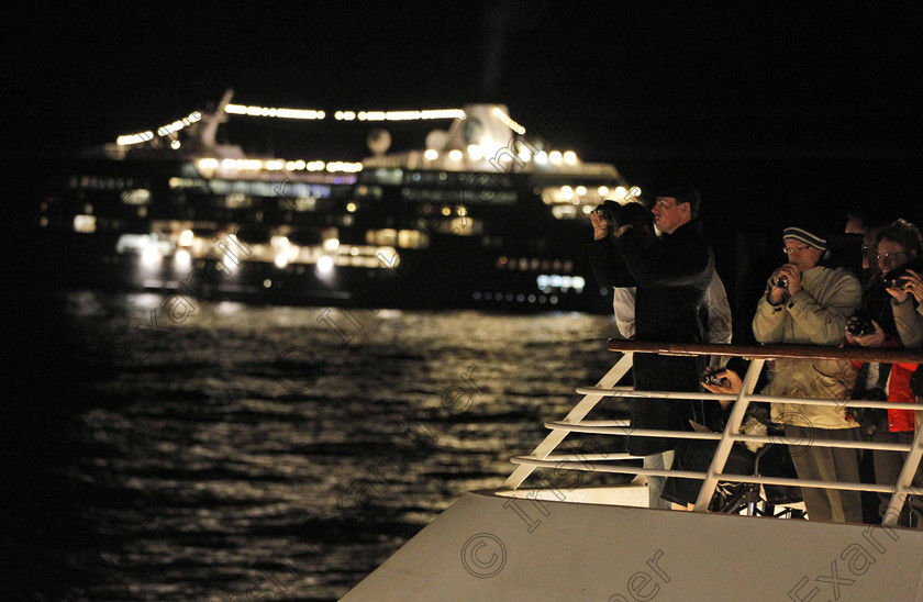 SEA Titanic 12 
 Passengers participate in a memorial service, marking the 100th year anniversary of the Titanic disaster, aboard the MS Balmoral Titanic memorial cruise ship, at the wreck site in the North Atlantic Ocean, early Sunday, April 15, 2012. Cruise ship passengers and crew said prayers Sunday at the spot in the North Atlantic where the Titanic sank 100 years ago with the loss of more than 1,500 lives. (AP Photo/Lefteris Pitarakis)