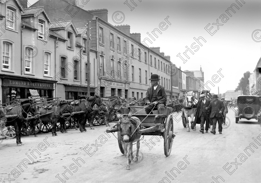 871092 
 Main Street, Midleton on fair day 10/08/1931 Ref. 743A Old black and white fairs streets donkeys carts farmers east cork