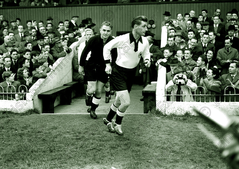 -1259825013 
 soccer - ireland v germany - international at dalymount park - 17/10/51 - ref. 231E TEAMS RUN OUT ONTO THE PITCH.