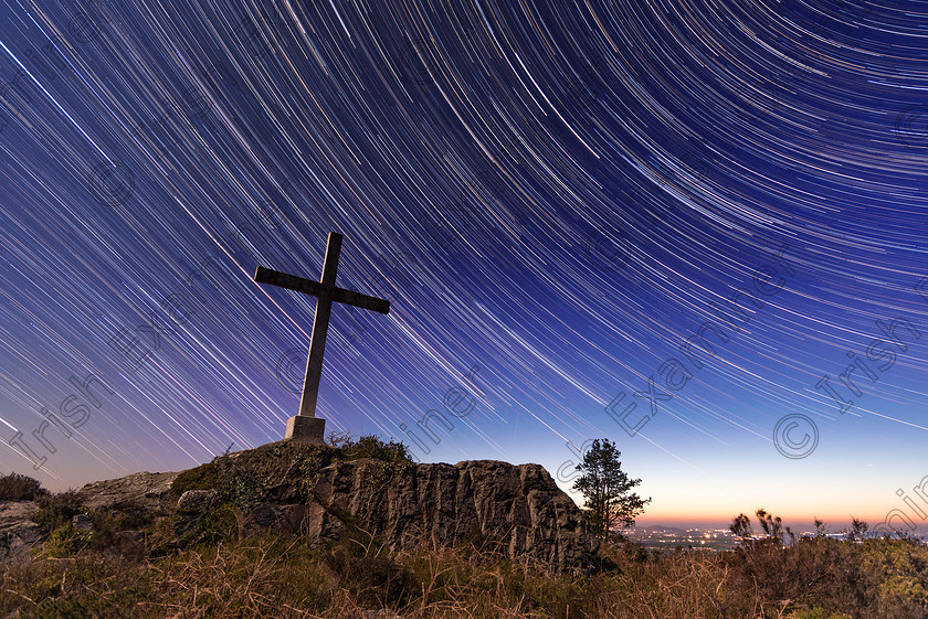 Star Trails Cross 
 Star Trails captured over the space of a few hours high up at Barntown, Wexford. A half half moon gently lit the cross and rocks in the foreground. Picture: Brian McDonald