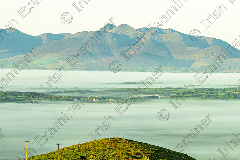 carr 2 
 An early morning shot from a high point just south of Tralee over the fog-covered mid-Kerry lowlands at Carrauntoohil (left centre peak). 7th May.