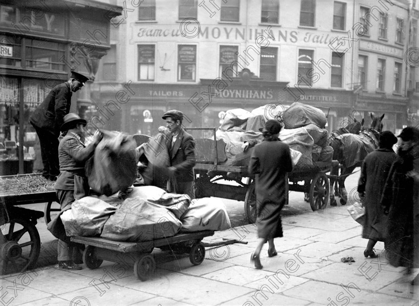 Oliver-Plunkett-Street-&-Post-office 
 Preparing to deliver the last of the Christmas post at the G.P.O., Oliver Plunkett Street, Cork 23/12/1936 Ref. CSS1