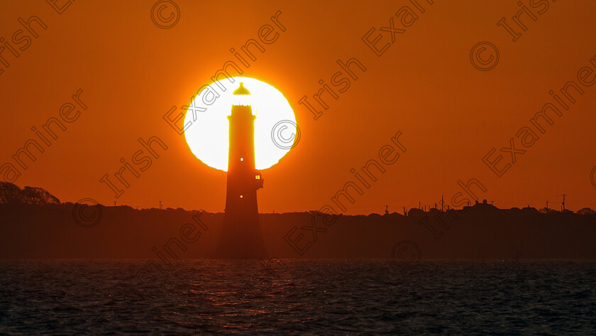 AM3A8405-2 
 This photo was taken this morning (Friday) at sunrise. The photo was lined up with the help of the photopills app and shows the sunrising behind Haulbowline Lighthouse on Carlingford Lough. It was taken from Ballagan Shore on the Cooley Peninsula, Co. Louth.