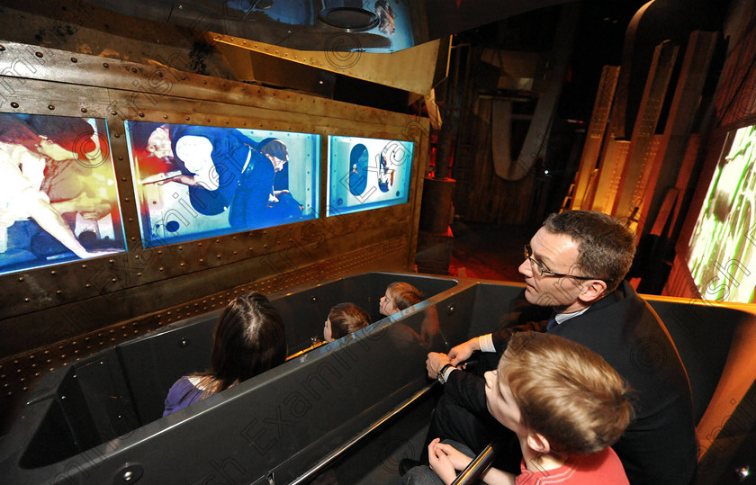 Titanic Belfast Preview 7 0 
 Alan Lewis - PhotopressBelfast.co.uk 27/3/2012
Mandatory Credit - Picture by Justin Kernoghan
The Quinn family from Belfast enjoying the 'shipyard ride' in Gallery Two (The Arrol Gantry). The Shipyard Ride - Believed to be the first of it's kind, the ride is a five minute journey in a six seater car (pictured top with number 1 on side) that rotates and moves up and down along a circuit accompanied by CGI, audio and special effects. Surrounded by full-size replicas, including riveting machines and Titanic's rudder, give a scale perspective into working life on the shipyard. The original Arrol Gantry was 840ft long, 240ft wide and 228ft high, and was in use until the 1960s. 
Press Release
Opening in March 2012, Titanic Belfast® will be a "must see" visit in any tour of Belfast and Northern Ireland. It is located in the heart of Belfast, on the slipways where RMS Titanic was built.
Inside this iconic building, visitors will re-live the entire Titanic story from her birth in Belfast to the fateful maiden voyage and her eventual discovery on the seabed.
Titanic Belfast® extends over nine galleries, with multiple dimensions to the exhibition, drawing together special effects, dark rides, full-scale reconstructions and innovative interactive features to explore the Titanic story in a fresh and insightful way; from her conception in Belfast in the early 1900s, through her construction and launch, to her infamous maiden voyage and catastrophic demise. The journey goes beyond the aftermath of the sinking, to the discovery of the wreck and continues into the present day with a live undersea exploration centre. 
Further info contact Jonathan King - 028 90339949/07764 627 297 
 Keywords: Alan Lewis 00447850 988920, Justin Kernoghan 00447525 763088, Photopress Belfast