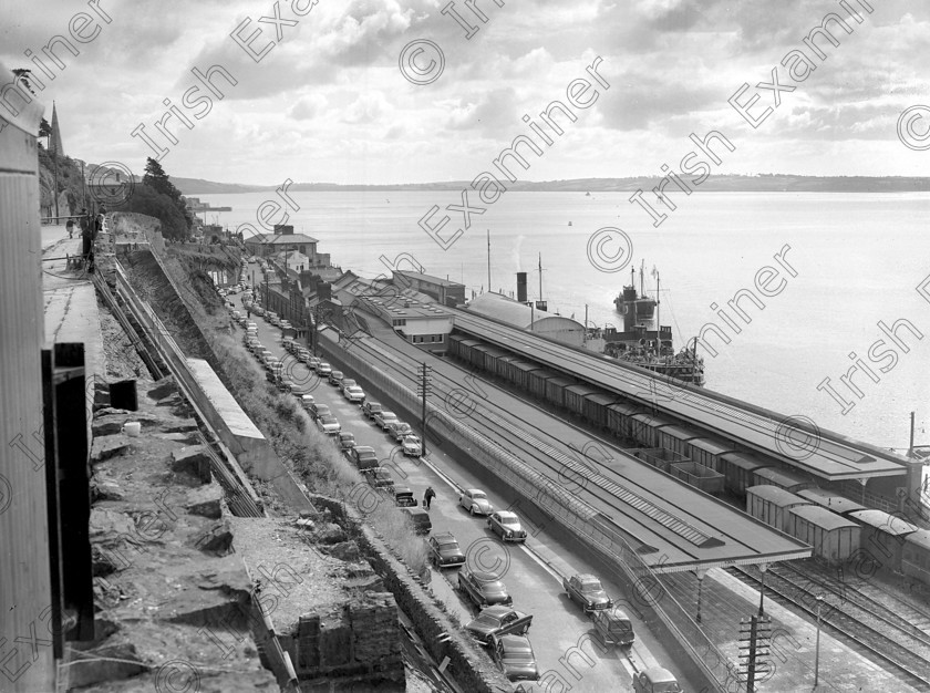 816983 816983 
 For 'READY FOR TARK'
The scene outside Cobh railway station after arrival of the tender serving the liner 'America'. 28/07/1961 Ref. 927L Old black and white liners ships stations cunard