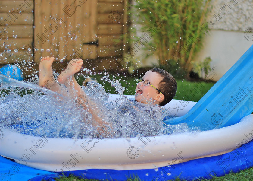 June 
 Four years old James O' Brien enjoys the sunny weather in his back garden in Sallins, Co. Kildare.