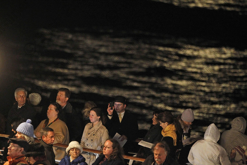 SEA Titanic 10 
 Passengers participate in a memorial service, marking the 100th year anniversary of the Titanic disaster, aboard the MS Balmoral Titanic memorial cruise ship, at the wreck site in the North Atlantic Ocean, early Sunday, April 15, 2012. Cruise ship passengers and crew said prayers Sunday at the spot in the North Atlantic where the Titanic sank 100 years ago with the loss of more than 1,500 lives. (AP Photo/Lefteris Pitarakis)