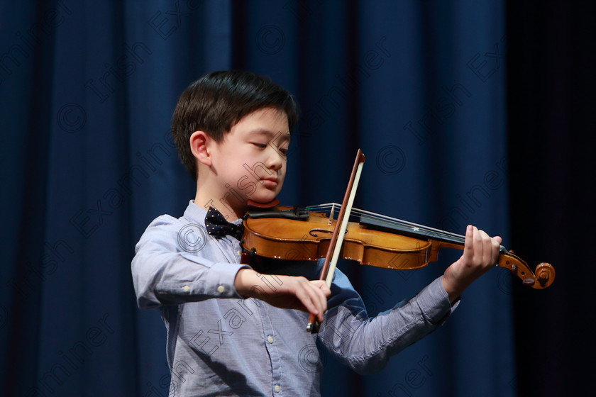 Feis0402109Mon32 
 31~32
Silver Medallist Zwyisen Bian from Limerick performing.

Class: 242: Violin Solo 8 Years and Under (a) Carse–Petite Reverie (Classical Carse Bk.1) (b) Contrasting piece not to exceed 2 minutes.

Feis Maitiú 93rd Festival held in Fr. Matthew Hall. EEjob 04/02/2019. Picture: Gerard Bonus