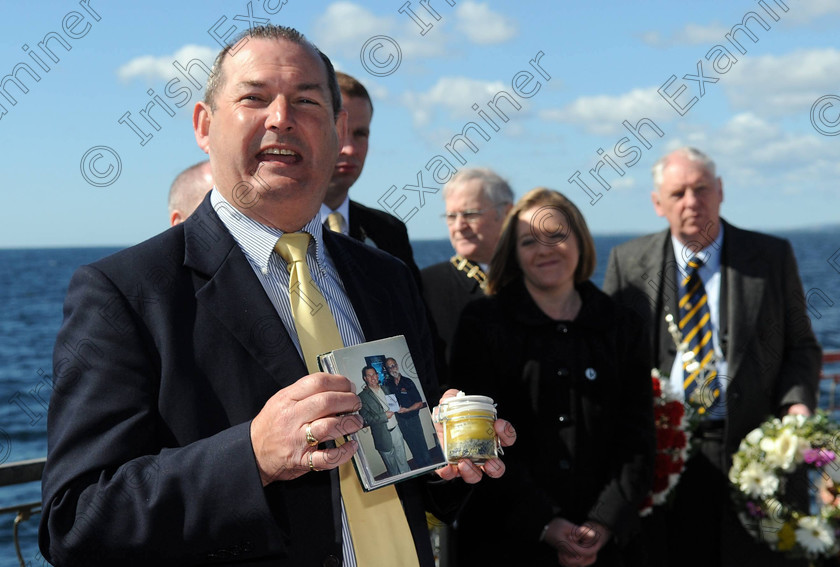 EOH Titanic wreath l101475 
 Michael Martin, Cobh Titanic trail with the ashes of Ralph C White, photographer on many Titanic expeditions' before they were dropped , at the spot where the Titanic berthed outside Cork harbour 100 years ago,. from on aboard the LE Eithne yesterday
Picture: Eddie O'Hare