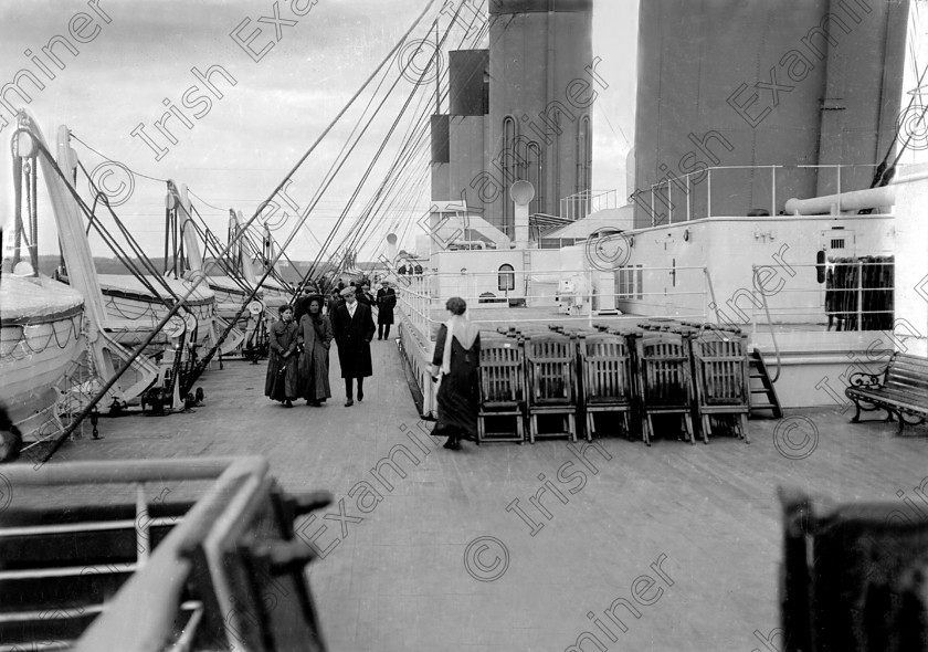 432448 
 Please archive -
In April, 1912 the RMS Titanic called to the port of Queenstown (Cobh) on her maiden voyage. The pride of the White Star Line arrived at Roche's Point at 11.30 a.m. A total of 123 passangers embarked at Queenstown. Three days later the liner struck an iceberg. Of the 2228 passangers and crew aboard only 705 survived. Picture shows passangers strolling along the deck of the doomed liner off Roche's Point. 
Ref.114/115 11/04/1912
Old black and white liners disasters