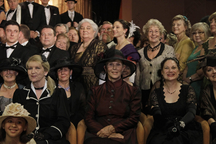 BRITAIN Titanic 20 
 Passengers in costumes pose for a group picture following a reception at the MS Balmoral Titanic memorial cruise ship, in the Atlantic Ocean, Friday, April 13, 2012. Nearly 100 years after the Titanic went down, the cruise with the same number of passengers aboard is setting sail to retrace the ship's voyage, including a visit to the location where it sank. The Titanic Memorial Cruise departed Sunday, April 8, from Southampton, England, where the Titanic left on its maiden voyage and the 12-night cruise will commemorate the 100th anniversary of the sinking of the White Star liner early Sunday, April 15, 2012. (AP Photo/Lefteris Pitarakis)