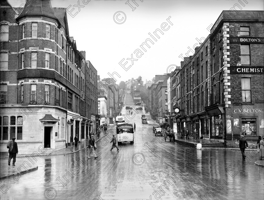 1072652 1072652 
 For 'READY FOR TARK'
View of Bridge Street, Cork in March 1937 Ref. 398B Old black and white busses city