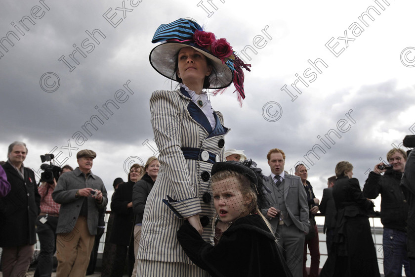 BRITAIN Titanic 18 
 In this photo taken Sunday, April 8, 2012, wearing period costumes, British passenger Jacki Free holds her daughter, name not given, as the MS Balmoral Titanic memorial cruise ship sails from Southampton, England. A cruise carrying relatives of some of the more than 1,500 people who died aboard the Titanic nearly 100 years ago set sail from England on Sunday to retrace the ship's voyage, including a visit to the location where it sank. (AP Photo/Lefteris Pitarakis)