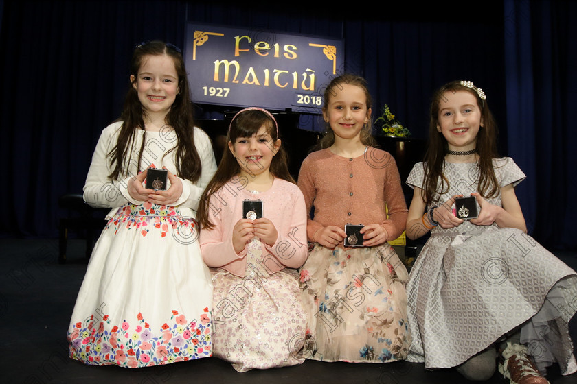 Feis27032018Tue13 
 13
Three Joint Bronze Medallists Leah Sweeney, from the City Centre; Abigail Adair from Carrigtwohill and Sophie Hennessy from Killshanna with Silver Medallist Jill Cleary from Kilshanna.
 Singing Class: 55: Girls Solo Singing 9 Years and Under Feis Maitiú 92nd Festival held in Fr. Mathew Hall. EEjob 27/03/2018 Picture: Gerard Bonus