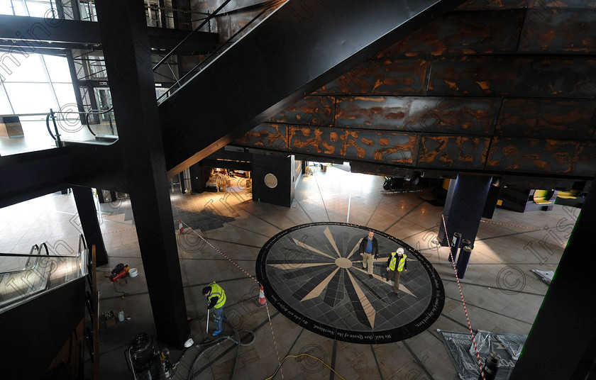 Titanic Belfast Preview 30 
 Alan Lewis - PhotopressBelfast.co.uk 14/3/2012
Mandatory Credit - Picture by Justin Kernoghan
Workers putting the finishing touches to the new Titanic Belfast building in the Titanic Quarter. 
Press Release
Opening in March 2012, Titanic Belfast® will be a "must see" visit in any tour of Belfast and Northern Ireland. It is located in the heart of Belfast, on the slipways where RMS Titanic was built.
Inside this iconic building, visitors will re-live the entire Titanic story from her birth in Belfast to the fateful maiden voyage and her eventual discovery on the seabed.
Titanic Belfast® extends over nine galleries, with multiple dimensions to the exhibition, drawing together special effects, dark rides, full-scale reconstructions and innovative interactive features to explore the Titanic story in a fresh and insightful way; from her conception in Belfast in the early 1900s, through her construction and launch, to her infamous maiden voyage and catastrophic demise. The journey goes beyond the aftermath of the sinking, to the discovery of the wreck and continues into the present day with a live undersea exploration centre. 
Further info contact Jonathan King - 028 90339949/07764 627 297
Embargoed until 17.00 Wednesday 14th March 2012 
 Keywords: Alan Lewis 00447850 988920, Justin Kernoghan 00447525 763088, Photopress Belfast