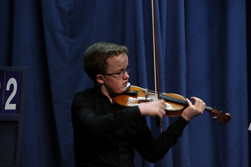 Feis09022018Fri06 
 6
Cillian Ó Cathasaigh performing.
 Instrumental Music Class: 232: “The Houlihan Memorial Perpetual Cup” 
String Repertoire 14 Years and Under Feis Maitiú 92nd Festival held in Fr. Mathew Hall. EEjob 09/02/2018 Picture: Gerard Bonus.