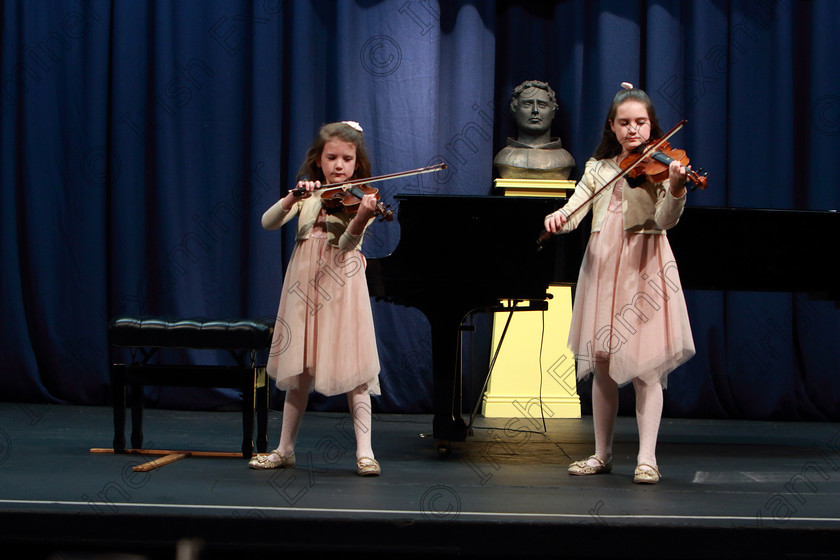 Feis01022020Sat32 
 32
Concentration from both Sisters Neasa and Saidhbh Randles playing the violin.

Class: 267: Junior Duo Class
Feis20: Feis Maitiú festival held in Fr. Mathew Hall: EEjob: 01/02/2020: Picture: Ger Bonus.