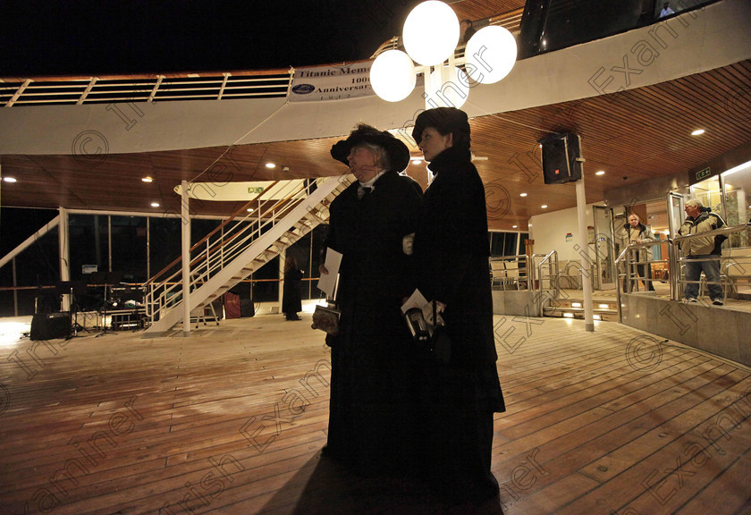 SEA Titanic 11 
 Passengers Maurine Beechler, left, and her daughter Amy Marie, both from Buffalo, NY, reflect following a memorial service, marking the 100th year anniversary of the Titanic disaster, aboard the MS Balmoral Titanic memorial cruise ship, at the wreck site in the North Atlantic Ocean, early Sunday, April 15, 2012. Aboard the Balmoral, a cruise ship taking history buffs and descendants of Titanic victims on the route of the doomed voyage, passengers and crew hold two ceremonies at the site of the disaster, 640 kilometers (400 miles) off the coast of Newfoundland - one marking the time when the ship hit the iceberg, the other the moment it sank below the waves. (AP Photo/Lefteris Pitarakis)